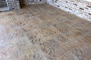 Stamped polymer concrete overlay on a patio 