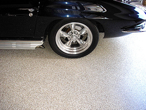 The ColorFlake epoxy garage floor coating is a perfect fit underneath this classic Corvette.