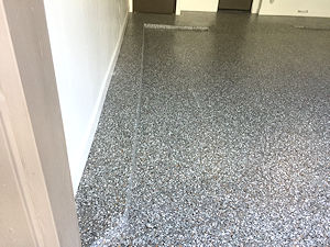 The ColorFlake garage floor epoxy coating is not only attractive and easy to maintain, but is impervious to fuel, motor oil and even brake fluid drips.