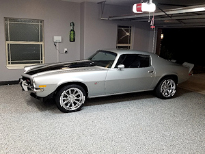 The ColorFlake epoxy coating on the garage floor sets the stage for this cool Chevy Camaro.