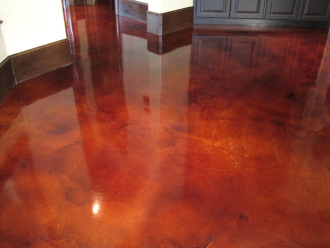 Dye stained concrete done in striking 'blood red' mottled coloring, from Surface Systems of Texas