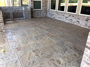 Turn a plain concrete patio in a beautiful area like this with our stamped polymer concrete overlay