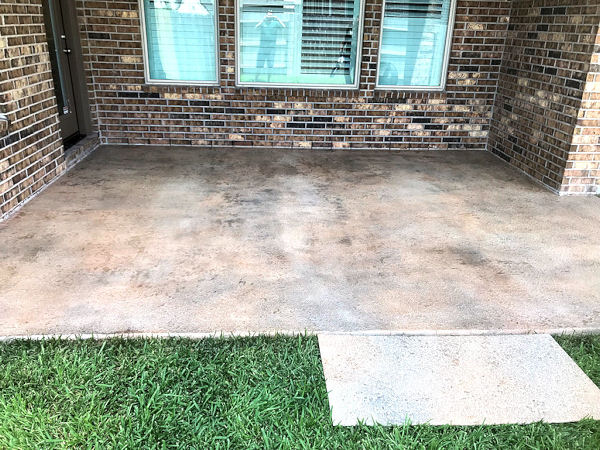 Slip-resistant TerraStone polymer concrete overlay in mottled coloring on a small patio, from Surface Systems of Texas