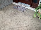 TerraStone concrete coating on a front porch, in Faux colors and tile-like pattern - by Surface Sysyetms of Texas